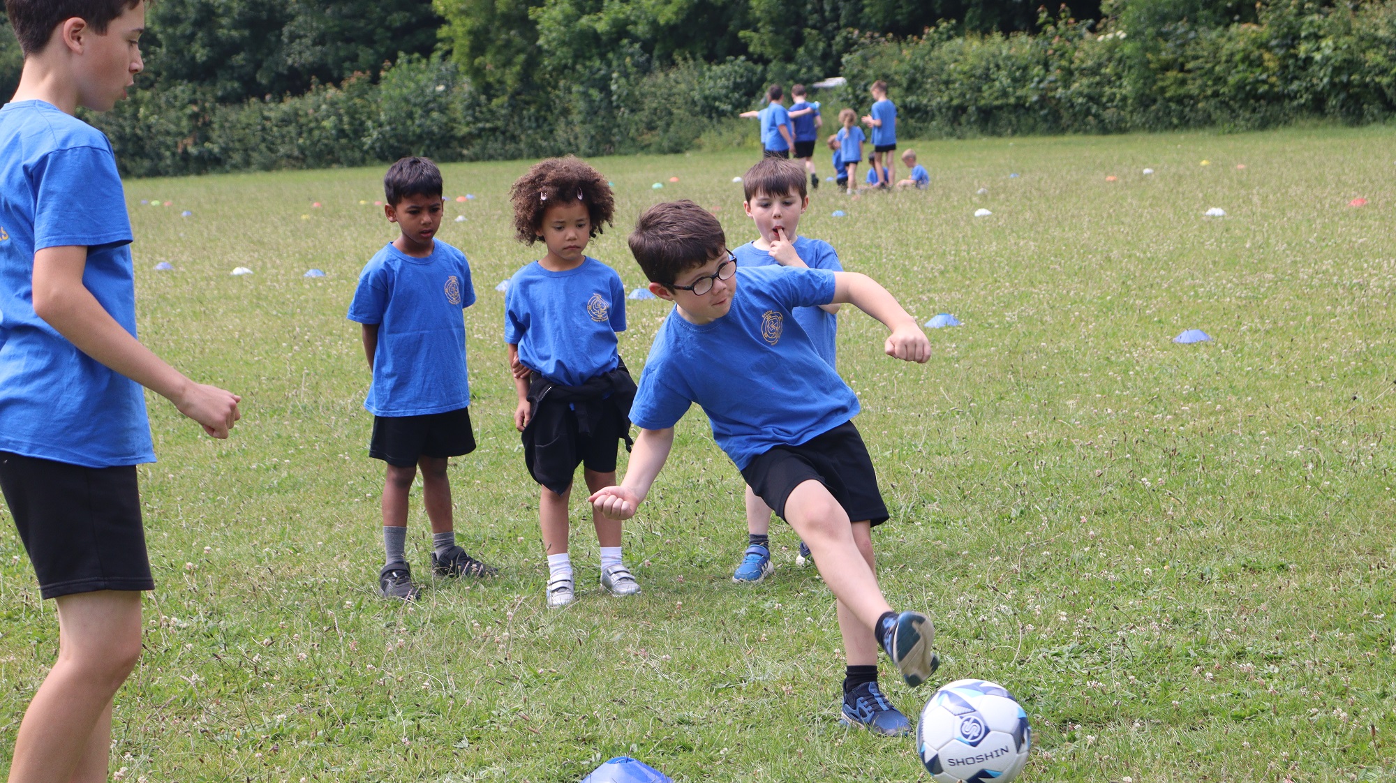 Pupils at Exning Primary School playing football