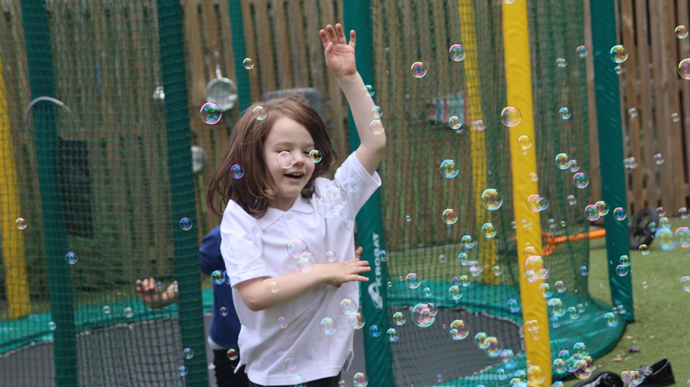 Pupil playing at Exning Primary School